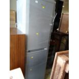 A Beko upright fridge freezer in silver E/T