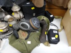 A canvas cased WWII gas mask, a GEC flashlight etc