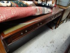 A large reproduction mahogany partner-style drop end desk with green leather tooled top, three