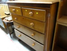 An antique pine chest of drawers, two-short above three-long drawers on raised feet