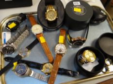 A parcel of gents modern 'chunky' wristwatches & three gentlemen's costume rings