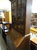 A vintage oak bureau glazed topped bookcase