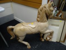 A floor standing carved wooden horse