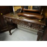 A nice antique carved oak side table with carved railback & single drawer
