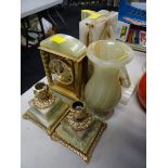 A suite of onyx ware including candlesticks & clock