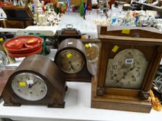 A group of mixed clocks including a silver dial architectural-type & two polished