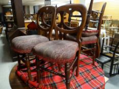 A set of five early twentieth century mahogany balloon backed dining chairs with upholstered seats