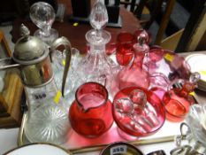A good collection of cranberry glass together with two cut glass decanters & a claret jug etc