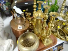 A pair of Queen of Diamonds-style brass candlestick holders, a pair of smaller similar, two
