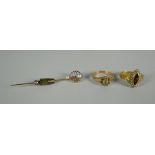 A GOLD & PEARL HAT-PIN & TWO RINGS the pin marked 14k and with two natural pearls, an antique ring