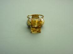 A FOURTEEN CARAT GOLD CITRINE DRESS RING with emerald cut faceted citrine, approximately 12.5 x 8.