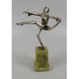JOSEF LORENZL SCULPTURE OF A DANCER - figure in a high-kick pose on a stepped green onyx base,