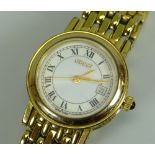 A MODERN YELLOW METAL 7300L SAPPHIRE CRYSTAL LADIES GUCCI WRISTWATCH with gate-link bracelet