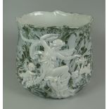 A CONTINENTAL PORCELAIN JARDINIERE with pat-sur-pat style decoration of maiden & cherubs within a