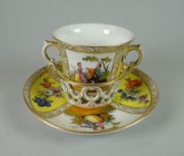 AN AUGUSTUS REX CHOCOLATE CUP & STAND having twin-handles and basket-saucer painted with alternate