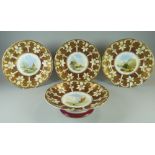 A FOUR-PIECE PART DESSERT SERVICE comprising three plates & fruit stand, each with painted