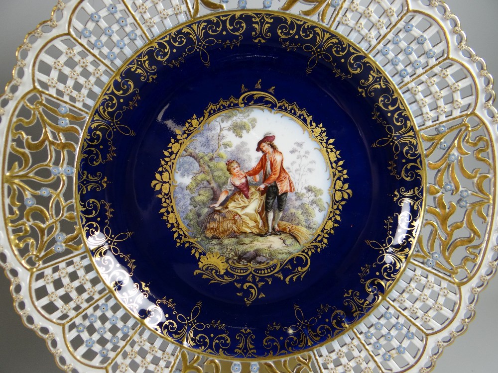 A PAIR OF MEISSEN RIBBON PLATES centred with a hand decorated Watteau-style vignette of courtiers in - Image 3 of 4
