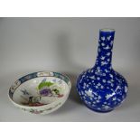 A CHINESE FOOTED BOWL interior decorated with mystical figures & a floral border, 24cms diam,