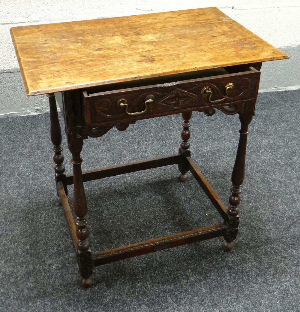 A NINETEENTH CENTURY CARVED OAK LOWBOY having a single drawer with open work scrolling frieze and - Image 2 of 2