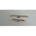 AN UNMARKED BELIEVED 9CT GOLD & SAPPHIRE BAR BROOCH, 3.5gms together with an aquamarine smaller