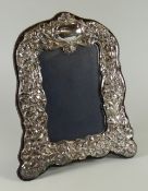 A MODERN REPRODUCTION SILVER EASEL PORTRAIT FRAME with raised Victorian style decoration, Birmingham