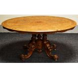 A VICTORIAN MARQUETRY WALNUT BREAKFAST TABLE tilting over an elaborate carved four scroll and
