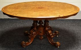 A VICTORIAN MARQUETRY WALNUT BREAKFAST TABLE tilting over an elaborate carved four scroll and