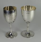 TWO SILVER GOBLETS both with knopped stem, one of plain form and the other with engraved decoration,