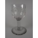 AN MID-EIGHTEENTH CENTURY GLASS GOBLET having an ovoid bowl etched with Jacobite emblems of rose,