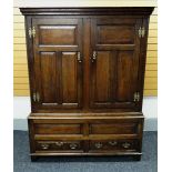 A NINETEENTH CENTURY OAK PRESS CUPBOARD having a two door panelled top above a two drawer base