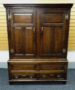 A NINETEENTH CENTURY OAK PRESS CUPBOARD having a two door panelled top above a two drawer base
