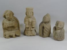 FOUR UNUSUAL SANDSTONE FIGURES one being a religious figure reading, another with two bags of money,