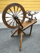 A MAINLY ELM WOOD NINETEENTH CENTURY SPINNING WHEEL