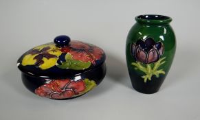 A MOORCROFT BLUE GROUND DISH & COVER (A/F) together with a miniature Moorcroft baluster vase