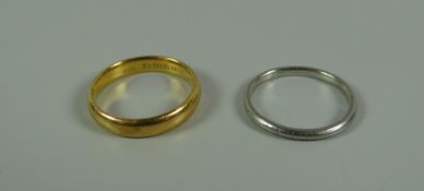 A 22k YELLOW GOLD BAND RING, 5.4gms & a white metal band ring