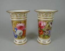 A PAIR OF NINETEENTH CENTURY SPILL-HOLDERS with flared rims and inverted foot, bead-work to lower