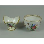 A MEISSEN PORCELAIN EYEBATH & CUP having floral relief decoration to each with gilded detail &