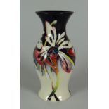 A 2007 MOORCROFT SMALL BELLIED VASE (No.317) in the Joy pattern by Nicola Slaney, 13cms high