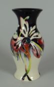 A 2007 MOORCROFT SMALL BELLIED VASE (No.317) in the Joy pattern by Nicola Slaney, 13cms high