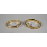 A 9CT YELLOW GOLD BANGLE, 12.4gms and another with metal core