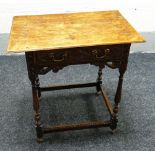 A NINETEENTH CENTURY CARVED OAK LOWBOY having a single drawer with open work scrolling frieze and