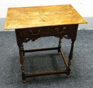 A NINETEENTH CENTURY CARVED OAK LOWBOY having a single drawer with open work scrolling frieze and