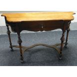 A SHAPED MAHOGANY SIDE TABLE with single drawer, raised above turned & tapering four corner supports