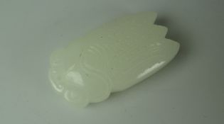 A CHINESE CARVED WHITE JADE STYLIZED INSECT, 4.5cms long