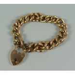 A 9ct YELLOW GOLD HOLLOW LINK BRACELET & HEART SHAPED PADLOCK, 24.1gms