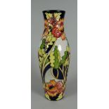 A 2006 MOORCROFT LIMITED EDITION (75/150) SLENDER VASE in the Woodland Path pattern by Kerry