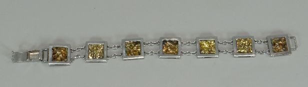 A BELIEVED SILVER & NATURAL GOLD TILE BRACELET, marked 925 and with 230 next to a star hallmark