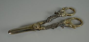 A PAIR OF ELIZABETH II SILVER GRAPE-SCISSORS having fox and vine loop handles, Sheffield 1962, 3.