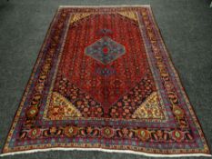 PERSIAN CARPET blue and red ground, 192 x 284cms