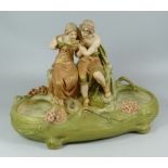 ROYAL DUX FIGURAL BASIN in typical blush glaze & with two robed companions one consoling the other